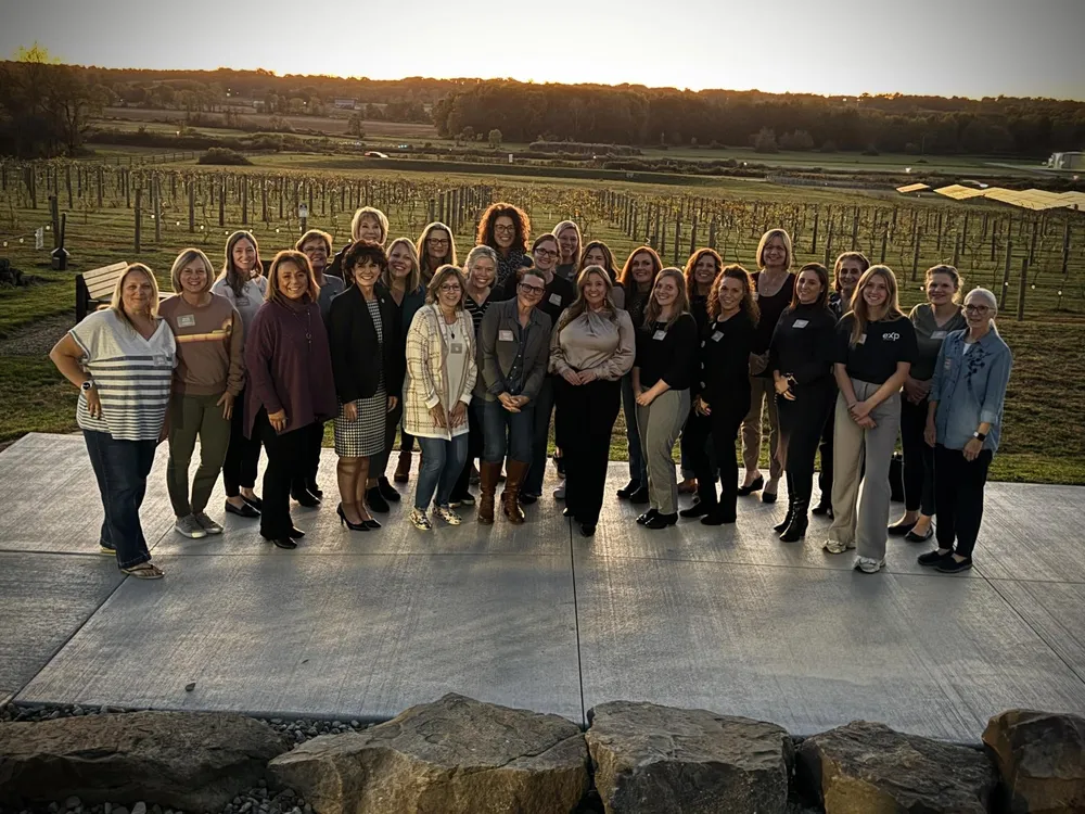 Chamber members together outdoors at an evening event