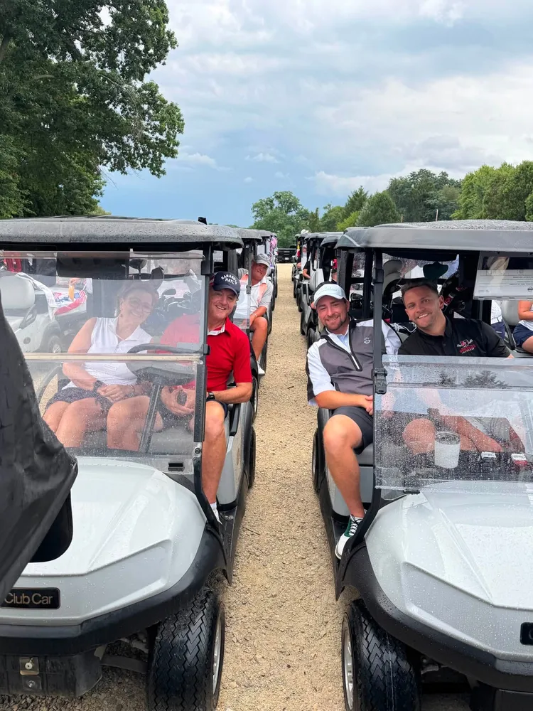 Golfers lined up in carts at the Chamber golf outing